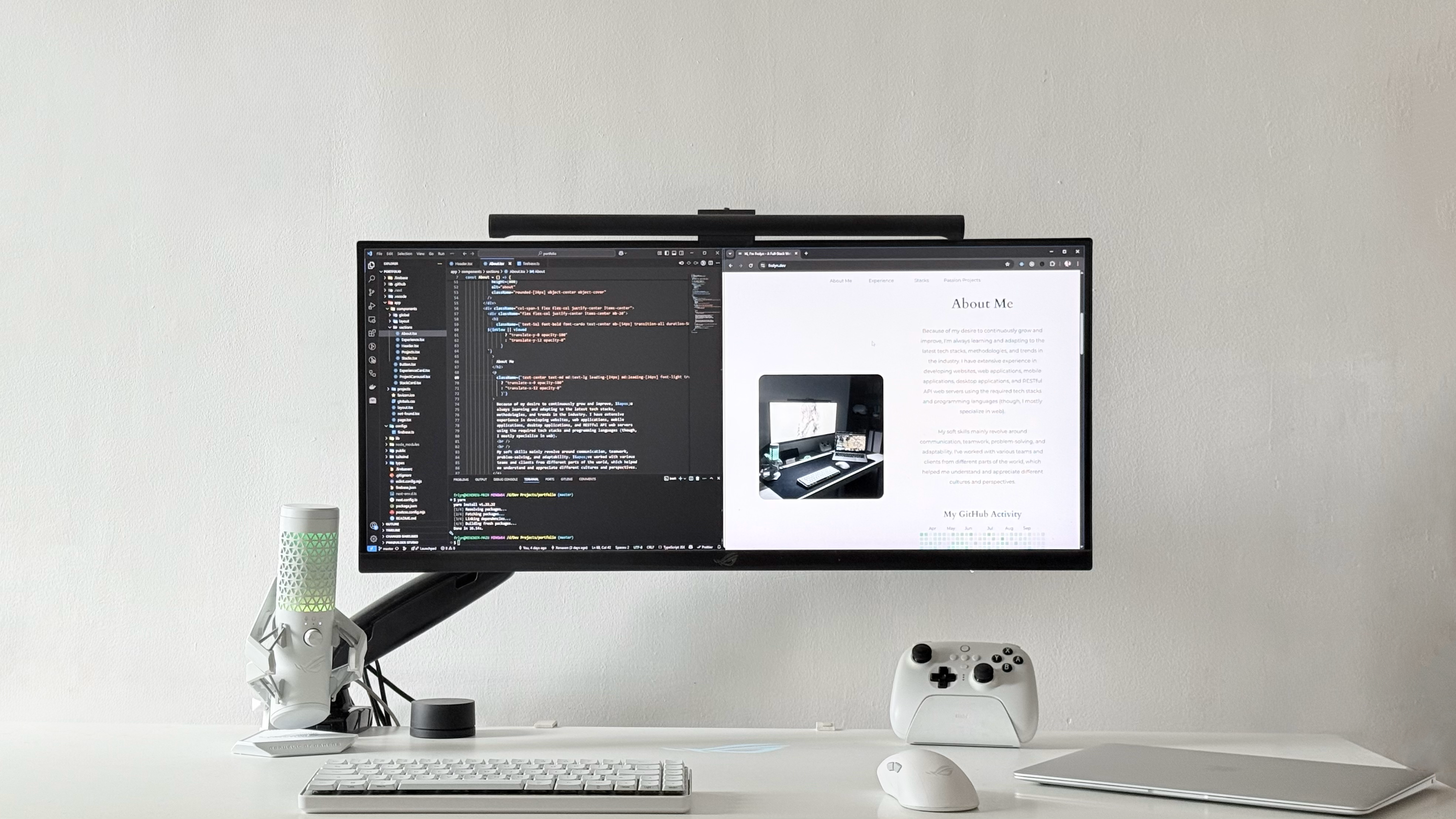 Professional workspace showing web development environment with multiple monitors, code editor, and modern development tools